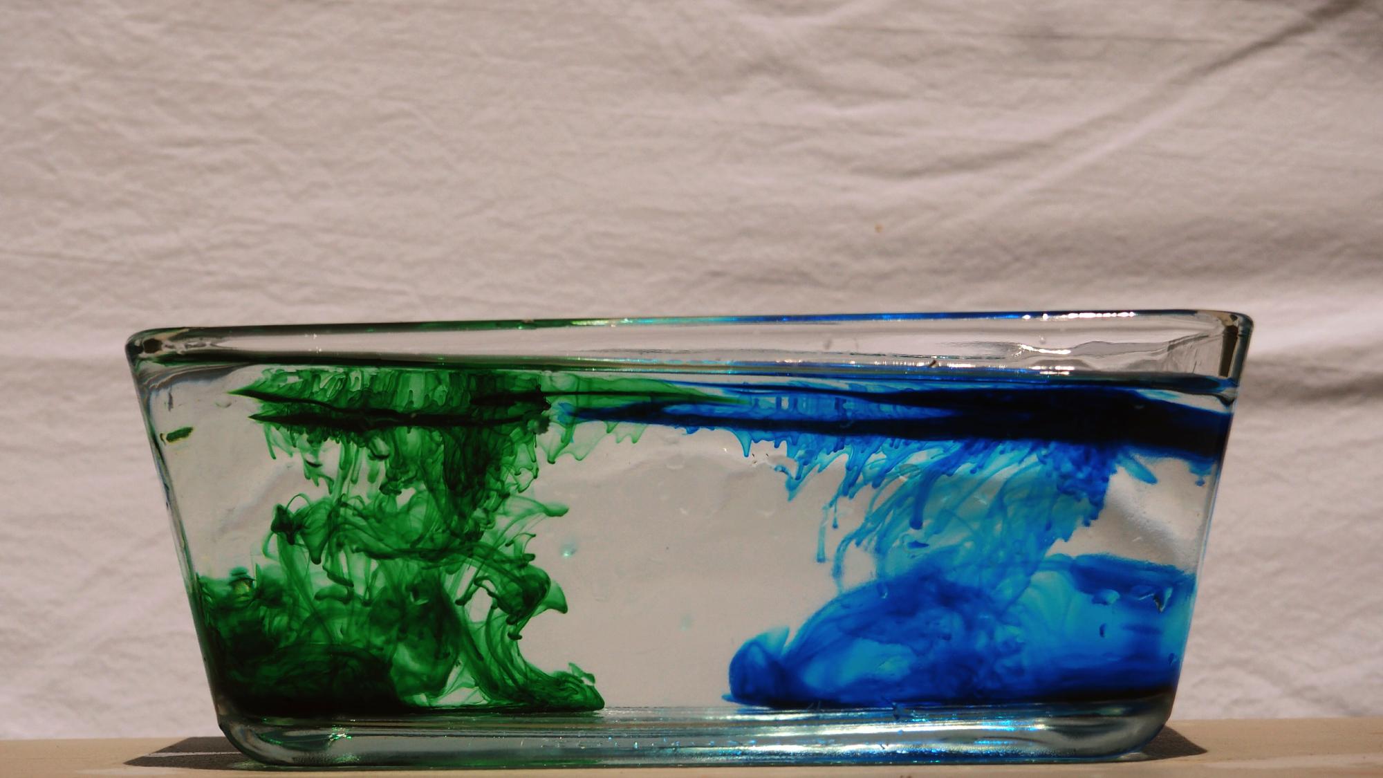 close-up-green-blue-ink-water_1048944-23198576