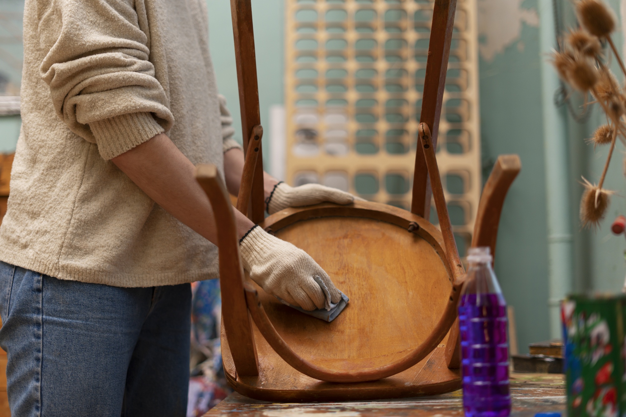 woman-restoring-wooden-chair-side-view_23-2150062476